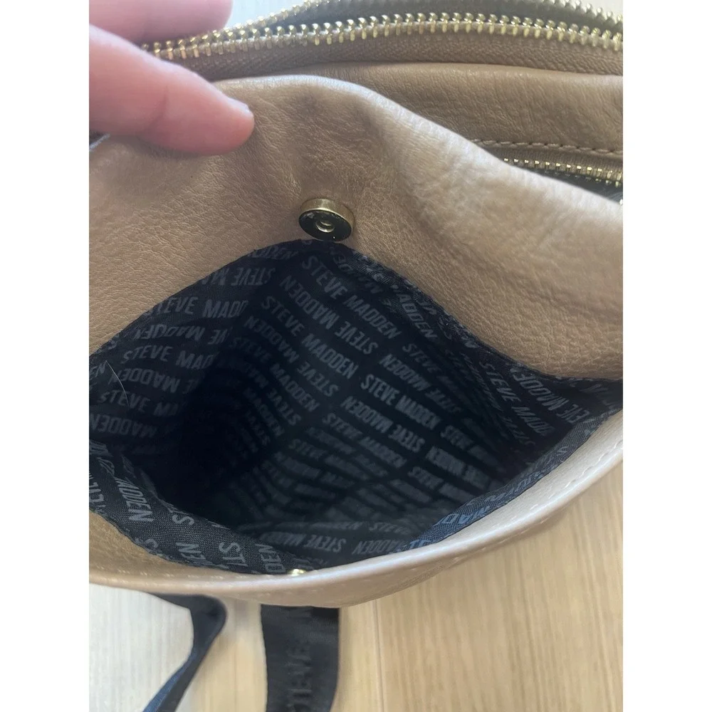 Steve Madden Taupe Embossed Logo Crossbody Bag Tassel Black Strap Gold Hardware